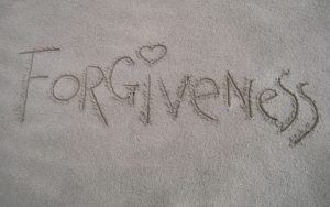 Forgiveness written in the sand.