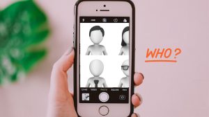A cell phone with blank faces asks the question, who are you?