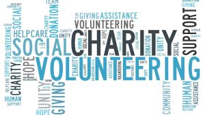 Sign with loads of writing: Charity, Volunteering, etc