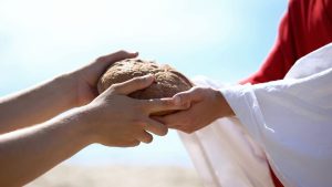Handing someone a loaf of bread - generosity.