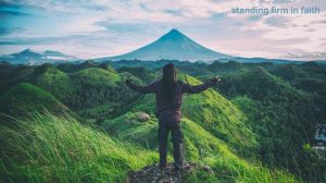 standing firm and unmoving during a strong wind, symbolizing standing firm in faith