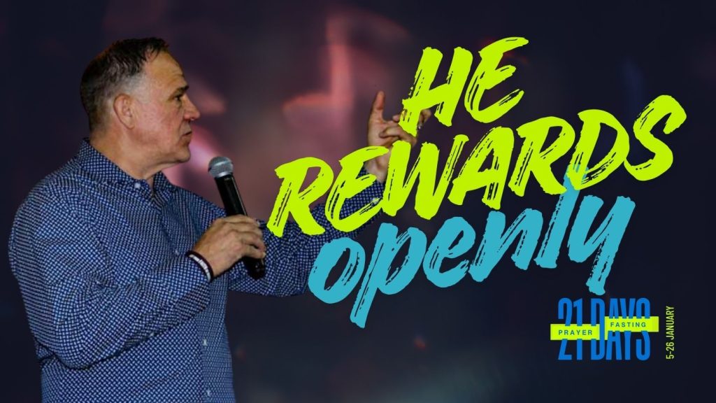 A photo of Ps Larry Elliot with writing - He rewards openly