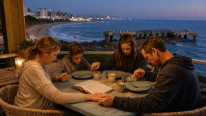 South African family praying together overlooking the KZN South Coast pier
